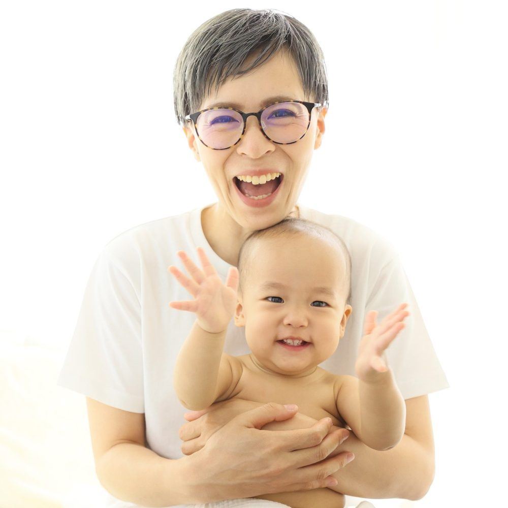 まんまるあたま整体 — 代表と赤ちゃんの笑顔